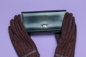 Elegant Black Clutch and Stylish Gloves on Purple Background for Fashion Enthusiasts