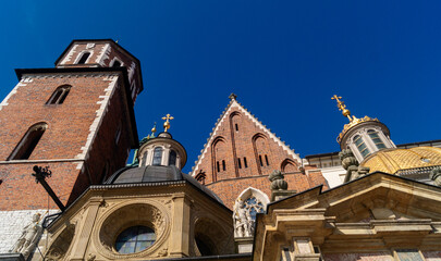 Decorations of Wawel Cathedral. The tops of architectural buildings of different styles of Wawel Cathedral and the bell tower