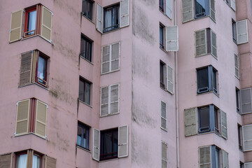 Fototapeta premium Residential Building Facade with Repeating Windows and Shutters