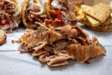 Gyro sliced meat closeup, doner shawarma wraps, traditional greek street food