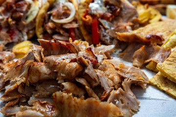 Gyro sliced meat closeup, doner shawarma wraps, traditional greek street food