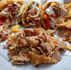Gyro sliced meat closeup, doner shawarma wraps, traditional greek street food
