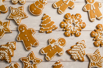 Holiday background. Christmas gingerbread cookies with icing flat lay, festive food, copy space