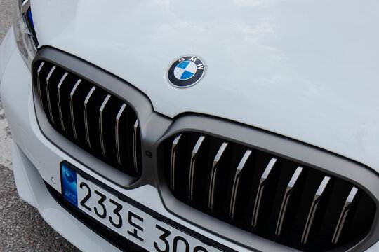 June 8, 2022, Seoul, South Korea - Close-up of the front grille and logo of a white BMW M550i car.