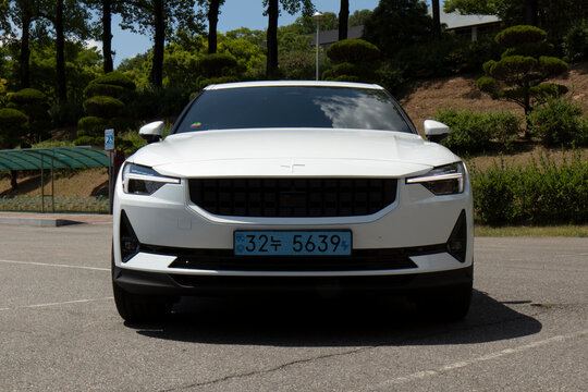 May 26, 2022, Seoul, South Korea - A white Polestar 2 electric vehicle parked in an outdoor parking lot.