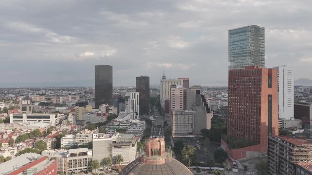 Aerial panoramic view as the drone ascends in front of the Monument to the Revolution, revealing the skyline around Plaza de la Rep&uacute;blica and Mexico City&rsquo;s historic center. Recorded in D-Log.
