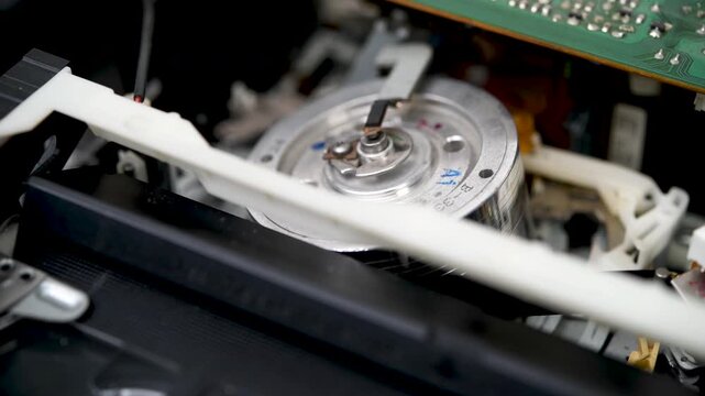 Operation of the film loading and unloading mechanism in a VCR