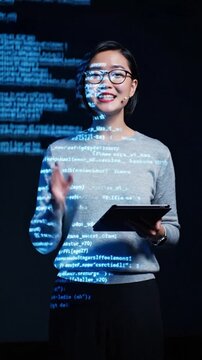 Vertical Screen : Group adult Asia female software developer mentor leader manager talk strategy plan to executive write prompt AI bot IT app program nomad, video game. Projecting slideshow code.