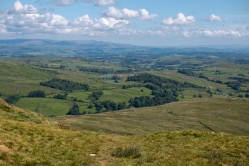 Naklejka premium Characteristic Lake District landscape with rolling hills and fields as seen from Wansfell Pike, England