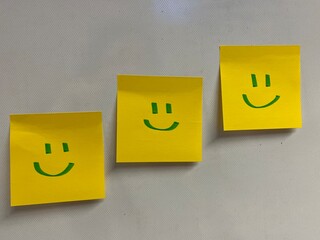 3 smiling faces hand drawing on yellow sticky notes, smiley faces, emojis, message, isolated