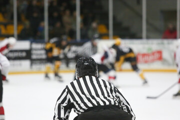 Hockey referee observing the game during a match