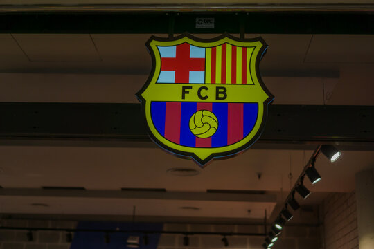 Barcelona, Spain, Europe - Nov 22, 2025: fc barcelona football club sign hanging illuminated logo inside official shop brand symbol close up editorial use only concept of sports team merchandising