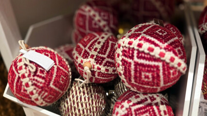 Festive red and white Christmas ornaments in decorative box for holiday season