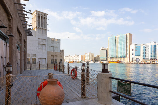 Old town in Al Seef Cultural Historical District. Beautiful view of water, old houses and new ones of Dubai Creek, Dubai, UAE.