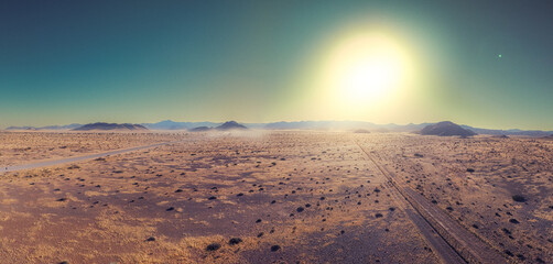 This high-quality drone photograph presents a sweeping aerial round flight over the dramatic landscapes of Namibia, offering a breathtaking bird’s-eye view of one of the world’s oldest deserts.