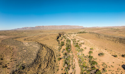 This high-quality drone photograph presents a sweeping aerial round flight over the dramatic landscapes of Namibia, offering a breathtaking bird’s-eye view of one of the world’s oldest deserts.