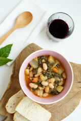 Overheard shot of Tuscan Ribollita, classic, hearty Tuscan white bean soup (stew) with vegetables