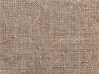 Hessian sackcloth burlap woven texture background / cotton woven fabric background with flecks of varying colors of beige and brown. with copy space. office desk concept
