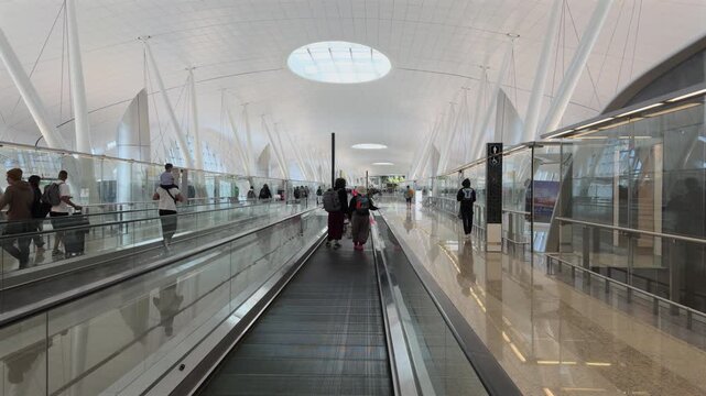 day time abu dhabi city international airport departure gate zone hall travelator ride panorama 4k united arab emirates