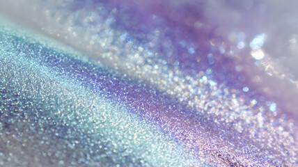 Abstract macro image of sparkling glitter texture in ethereal blue and purple colors