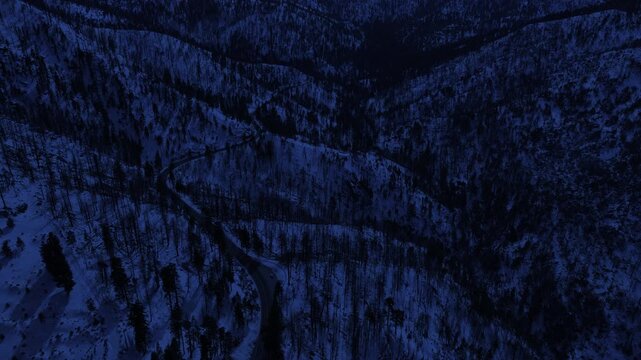 Night Snowcrest Aerial Shot of Winter Snow Forest Road Back Reveal Day for Night