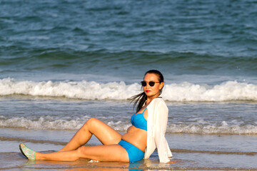 Woman sexy with blue bikini on beach