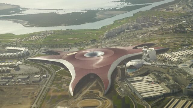 day time abu dhabi city flight over famous museum park aircraft passenger side window aerial panorama 4k united arab emirates