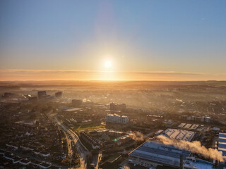 Golden Morning Light Over Basingstoke City With Mist and Smoke
