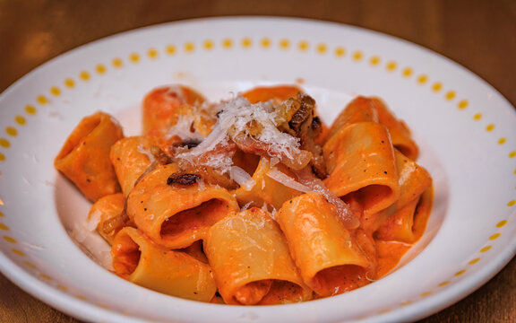 Thick Paccheri pasta Zozzona with pancetta and cheese in Zurich, Switzerland