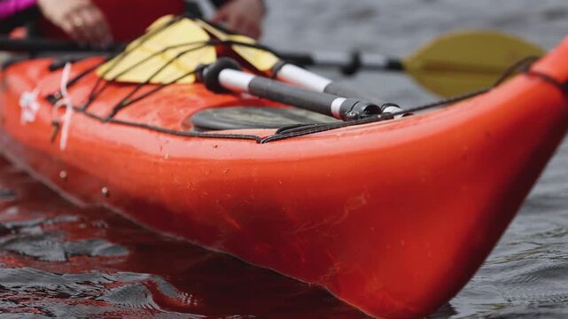Kayaking in the lake skerries, colorful canoe kayak boat paddling, canoeing in river, scandinavian landscape, group of tourists athletes in kayaks floating, kayakers rowing during water sports tour