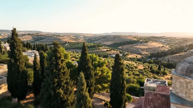 Aerial view of the historic Mar Elias Monastery and surrounding landscape near Jerusalem at sunset.