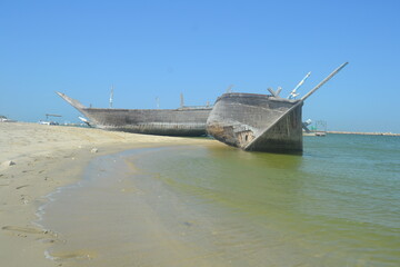 An old, broken boat looks out to sea. Hope slowly dies with it. Foggy future. 