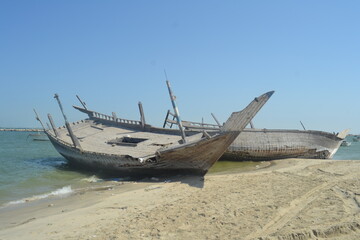 An old, broken boat looks out to sea. Hope slowly dies with it. Foggy future. 