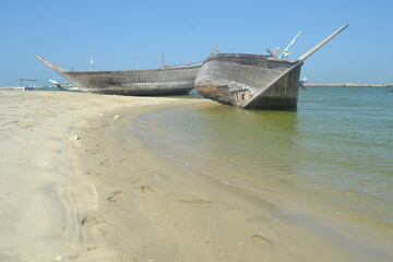 An old, broken boat looks out to sea. Hope slowly dies with it. Foggy future. 
