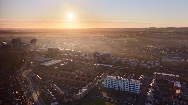Golden Morning Light Over Basingstoke City With Mist and Smoke