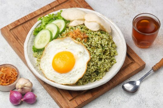 Nasi goreng cabe hijau. Green fried rice is a Indonesian fried rice that is green in color because it uses green chilies its main seasoning.