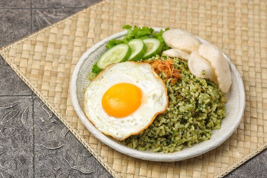 Nasi goreng cabe hijau. Green fried rice is a Indonesian fried rice that is green in color because it uses green chilies its main seasoning.