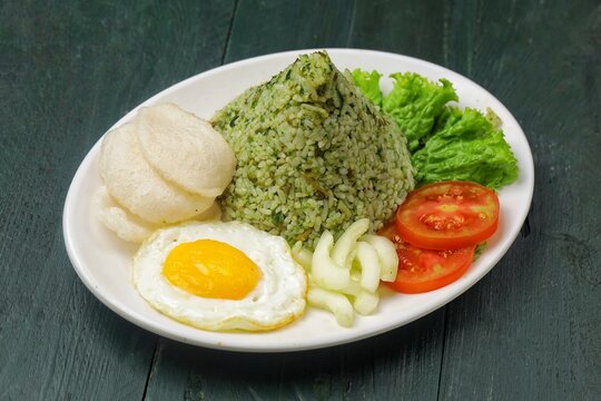 Nasi goreng cabe hijau. Green fried rice is a Indonesian fried rice that is green in color because it uses green chilies its main seasoning.