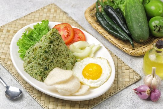 Nasi goreng cabe hijau. Green fried rice is a Indonesian fried rice that is green in color because it uses green chilies its main seasoning.