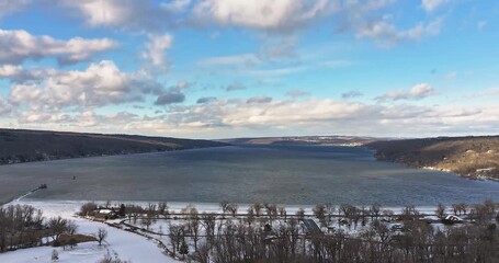Ithaca, NY, USA - December 11, 2025: Timelapse, hyper lapse, aerial video of Cayuga Lake, City of Ithaca, NY, USA
