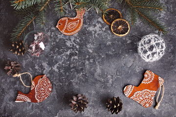 Christmas card with firtree pinecones and glass balls on old wooden board in rustic style copyspace.