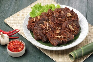 Empal daging sapi. Empal beef is a typical Indonesian food made from processed beef and cooked with spices.