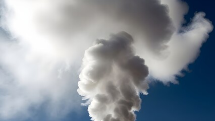 Thick White Plume of Smoke Rising Against a Clear Blue Sky