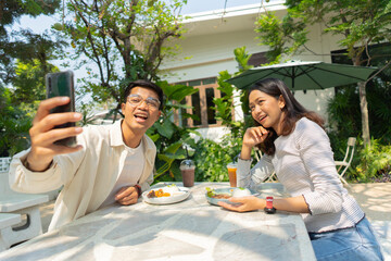 The couple is relaxing and visiting a cafe.