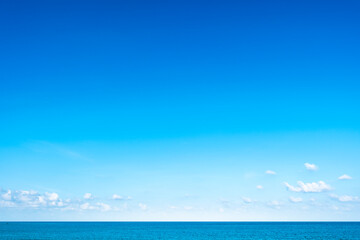 Nature of the ocean and blue sky Summer with sunshine, sandy beaches, clear blue waters sparkling against the blue sky. on an island with good ecology and environment Background for summer vacation