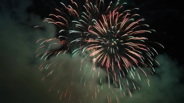 A single, powerful firework explosion seen through thick, atmospheric smoke, volumetric light