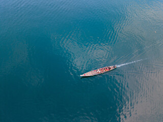 Scenic boat journey on tranquil Cheow Lan Lake in Khao Sok, Thailand at dawn