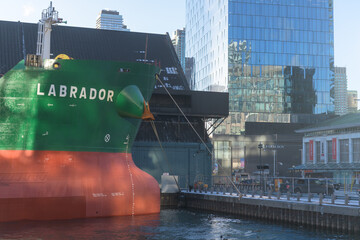 Fototapeta premium bulk carrier docked at the Jarvis St Slip next to Redpath Sugar Refinery, at 95 Queens Quay E, Toronto