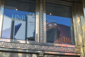Naklejka premium shiny metal historic door frame at the HNR building located at 21 Dundas Square, Toronto