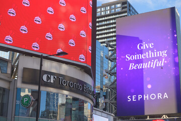 Naklejka premium exterior building facade and sign of CF Toronto Eaton Centre incl digital advertisements for Sephora, facing Sankofa Square, Toronto